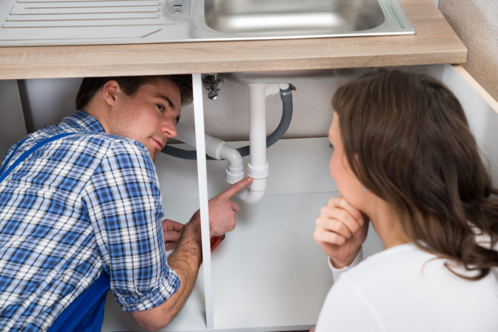 Checking house for odor under sink